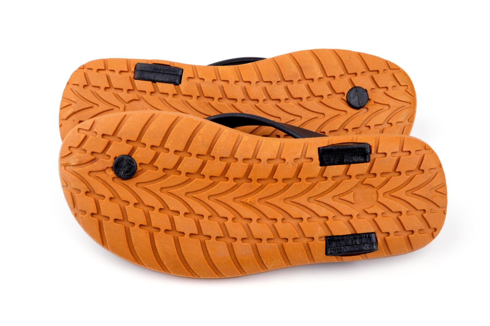Close view of rubber-soled flip flops on a white background