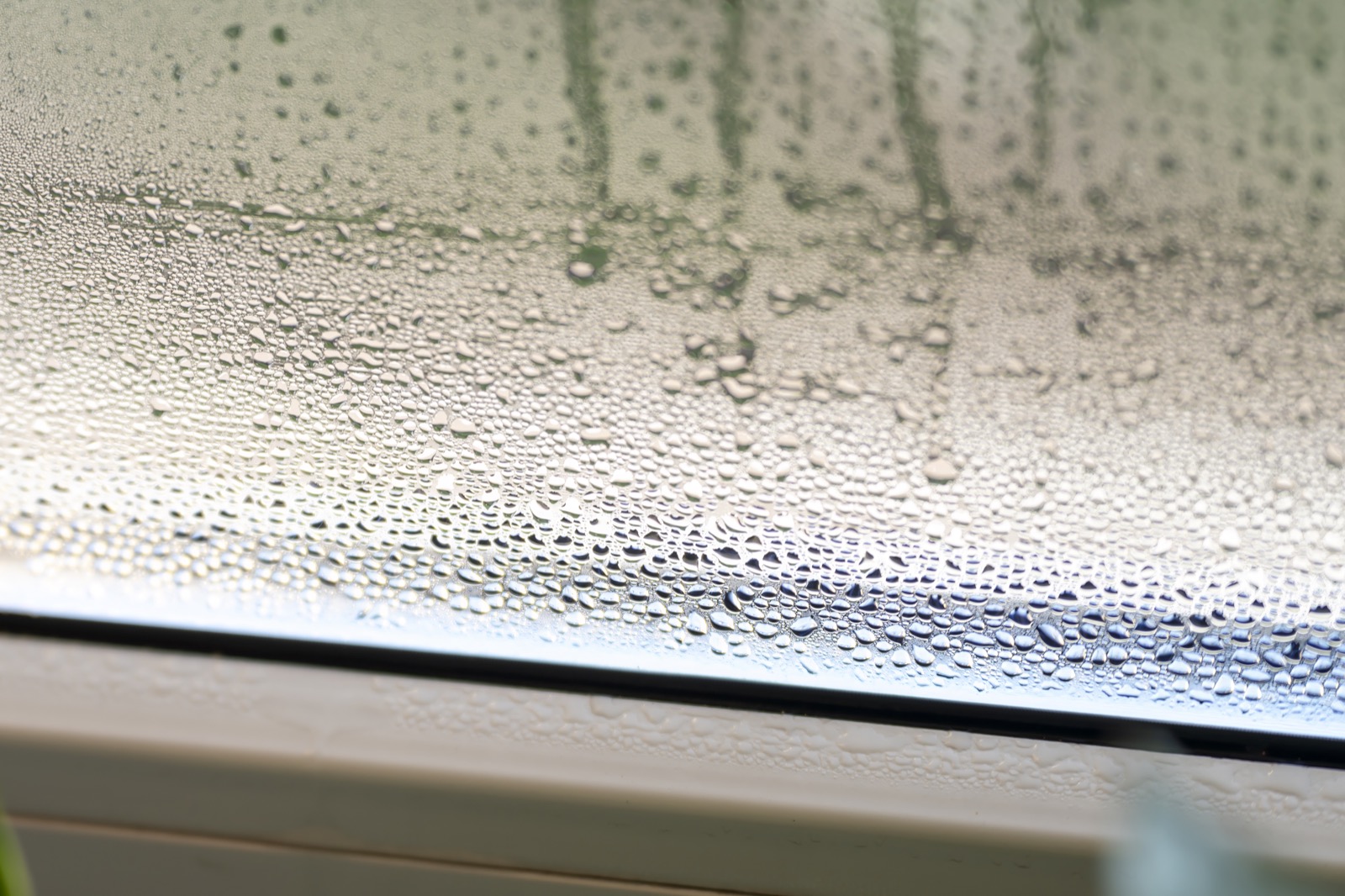 Heavy condensation on a home window caused by high indoor humidity