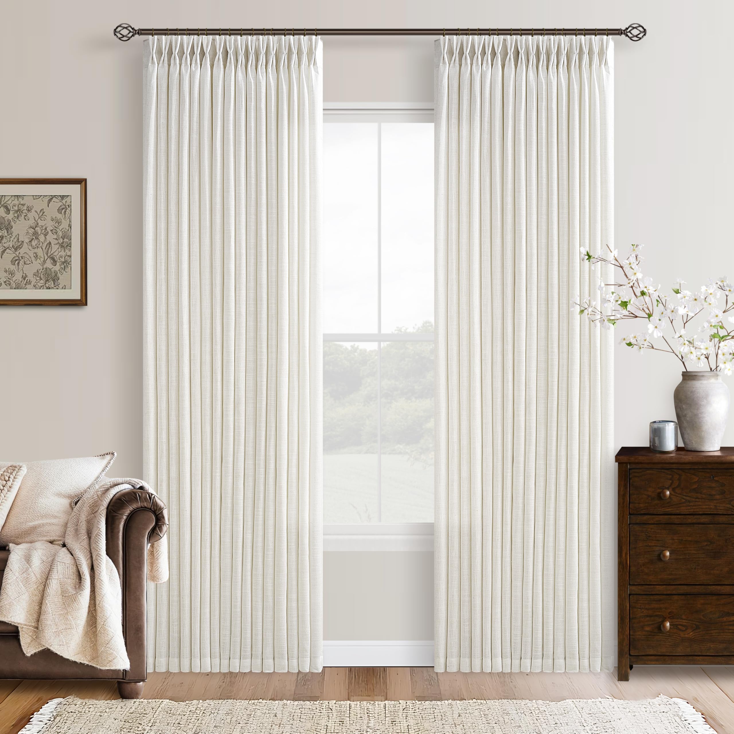 Natural cream linen pinch pleat curtains as a softer alternative to blackout panels